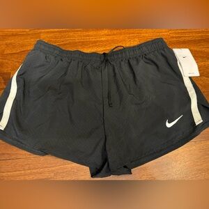 Nike running shorts. New with tags. Black. Mens Large.